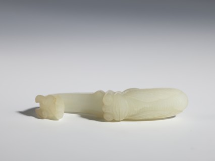 Belt clasp, Milky-white translucent jade. Chinese, Qing dynasty 1644–1911, 18th–19th century.