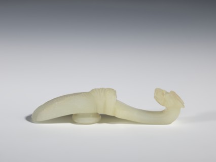 Belt clasp, Chinese, Qing dynasty 1644–1911, 18th–19th century. Milky-white translucent jade. Shaft