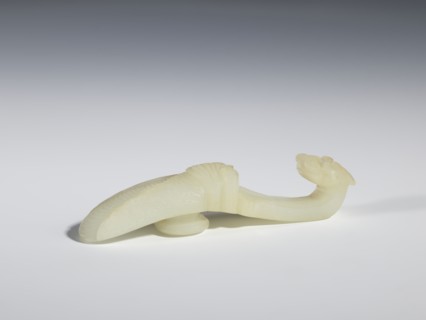Belt clasp, Chinese, Qing dynasty 1644–1911, 18th–19th century. Milky-white translucent jade.