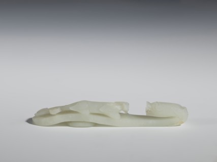 Belt clasp;, Chinese, Qing dynasty 1644–1911, 18th–19th century. Milky-white jadeite, slightly