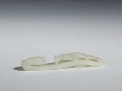 Belt clasp, Chinese, Qing dynasty 1644–1911. 18th–19th century. Milky-white jadeite, slightly