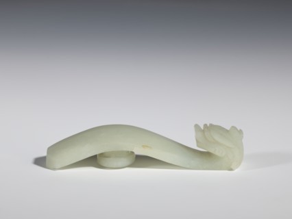 Belt clasp, stones, Milky-white jade with colloid clusters. Full-plastic carved head. Chinese, Qing