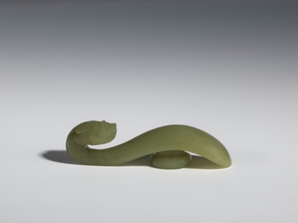 Belt clasp, Chinese, Qing 1644–1911, 17th–18th century. Jadeite with a green shade and visible