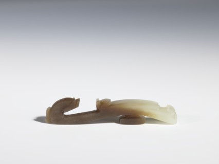 Belt clasp, Chinese, Qing 1644–1911, 17th–18th century. Gray-beige jadeite with chalcedony