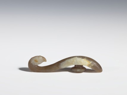 Belt clasp, purchase provenance; Chinese; Qing 1644–1911; brown jade with lighter spots;