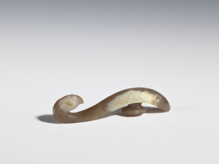 Belt clasp, Chinese, Qing 1644–1911, 18th–19th century. Brown jade with lighter spots; full-plastic