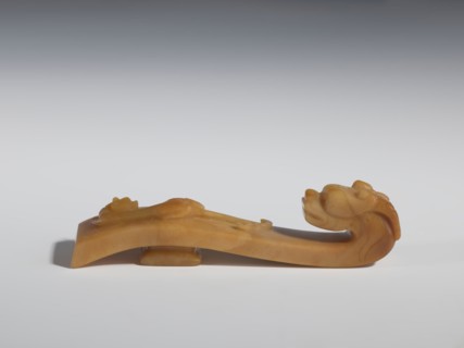 Belt clasp, Chinese, Qing 1644–1911, 18th–19th century. Brown chalcedony; shaft: bas-relief