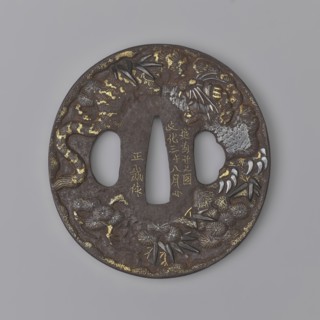 Crossguard tsuba, Masashige. Round tsuba maru gata with a slightly raised, irregularly outlined
