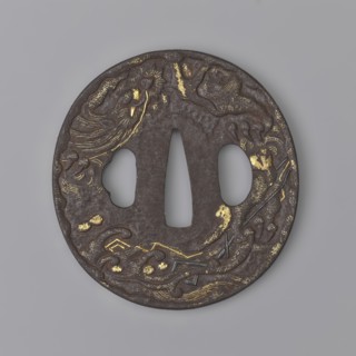 Crossguard tsuba, Masashige. Round tsuba maru gata with a slightly raised, irregularly outlined