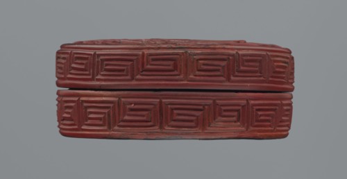 Box with lid; Chinese; red lacquer carved with meander leiwen, cloud and Buddhist ornament; reeds