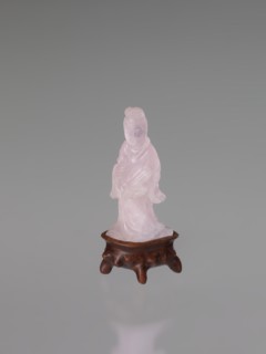Guanyin on a base, figurine carved in rose quartz, full sculpture with engraving; goddess of