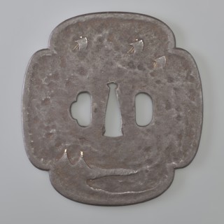 Crossguard tsuba, Kaneie, signed. Quatrefoil shape mokkô gata with a slightly raised edge of the