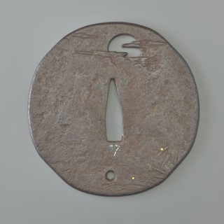Crossguard tsuba, Kaneie,  school craftsman author. Oval tsuba with an irregular outline slightly