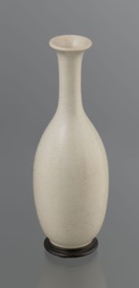 Vase on saucer. Vase made of stoneware or thick porcelain?, ovoid with a long cylindrical neck