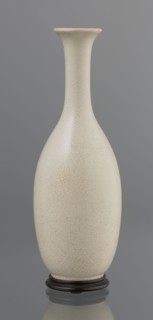 Vase on saucer. Stoneware or thick porcelain?, ovoid with a long cylindrical neck flaring at the