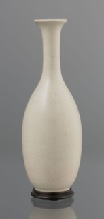 Vase on saucer. Vase made of stoneware or thick porcelain?, ovoid with a long cylindrical neck