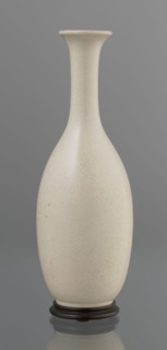 Vase on saucer. Vase made of stoneware or thick porcelain?, ovoid with a long cylindrical neck