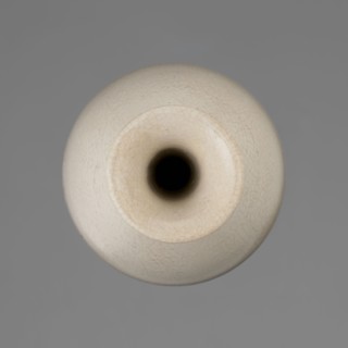 Vase on saucer. Vase made of stoneware or thick porcelain?, ovoid with a long cylindrical neck