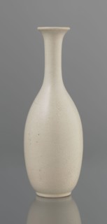 Vase on saucer. Vase made of stoneware or thick porcelain?, ovoid with a long cylindrical neck