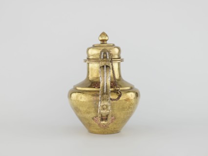 Teapot, Tibetan, 19th century. Jug with a lid on a chain; dragon-shaped handle, spout probably in