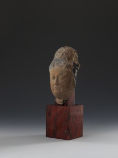 Head of Guanyin Bodhisattva, Polychrome-coated feldspar fragment of a statue with cube-shaped base