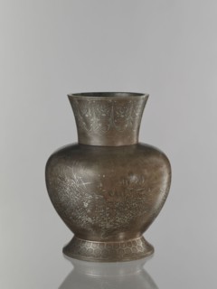 Vase, pewter alloy, ovoid bulbous vase on a wide base with a wide flared neck. Engraved decoration