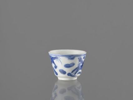Bowl, Chinese, 19th century. Blue-and-white porcelain vessel decorated with dragons, phoenixes
