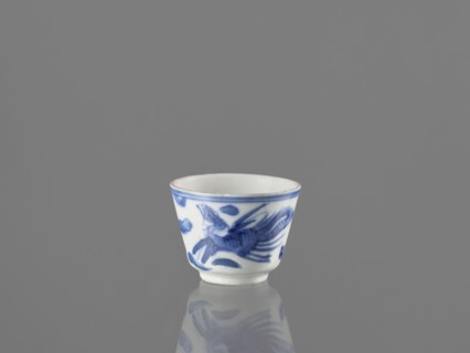 Bowl, Chinese, 19th century. Blue-and-white porcelain vessel decorated with dragons, phoenixes