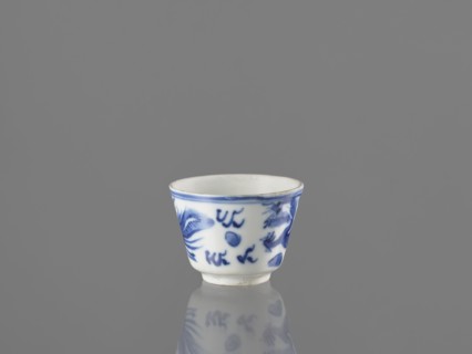 Bowl, Chinese, 19th century. Blue-and-white porcelain vessel decorated with dragons, phoenixes