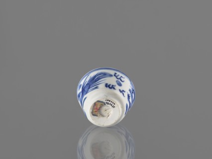 Bowl; Chinese; 19th century. Blue-and-white porcelain vessel decorated with dragons, phoenixes