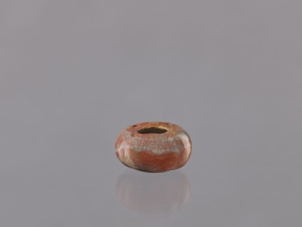 Cosmetic vessel, hand-made vessel head made of yellowish clay, hand-formed. Reddish glaze with gray