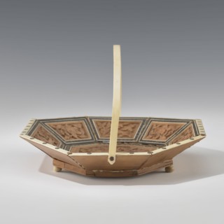 Basket, Octagonal, shallow wooden basket with an ivory rim and handle. Inside the basket is a