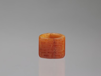 Signet ring, Chinese, Qing dynasty 1644–1911, opaque amber with convex relief, 18th–19th century,