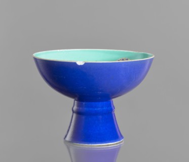 A tall footed porcelain bowl, Chinese, glazed ceramics; outer glaze stained cobalt, inner glaze