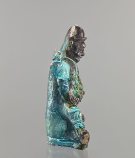 Warrior figurine, Chinese; ceramic sculpture of a male warrior with green-brown glaze; 17th