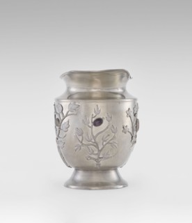 Jug, ornamented with plant motifs and fruit, featuring applied plastic decoration of flowering