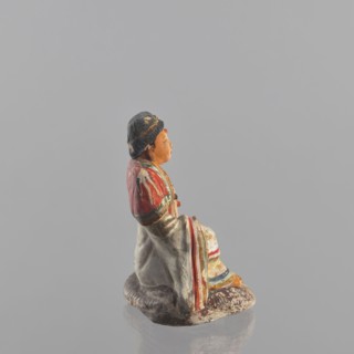 Figurine of a seated man; creator, Chinese; Chinese art; ceramics; male clothing; seated figure;