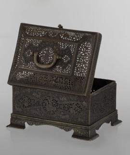 Box; Persian Qajar dynasty, 19th century. Rectangular box on four feet with a lid and handle. Iran.