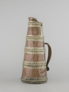 Tea pot;, 19th century, Tibet. Tea vessel/jug tapering towards the top with silver fittings and