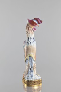 Bird, Chinese porcelain figure on a brown gilded openwork base with braided ornament and rosettes;