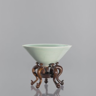 Bowl on base; maker, Shallow, round, profiled base with a round hole in the center; on five