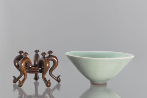 Bowl on base, maker, Shallow, round, profiled base with a round hole in the center; mounted on five