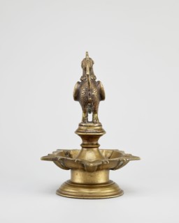 Oil lamp, 19th century, South India, Tamilnadu. Round base with a pentagonal oil vessel above which