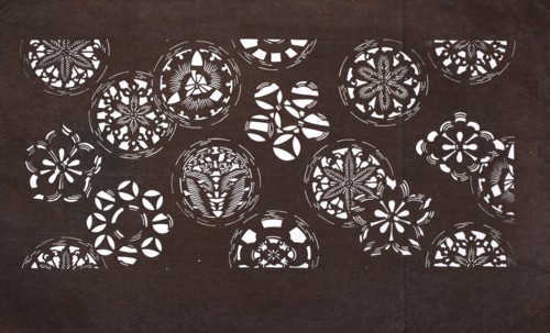 Katagami dyeing stencil with a motif of stylized floral rosettes and cherry blossoms kawari kamon