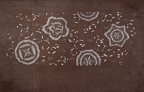 Katagami dyeing stencil with a motif of stylized flower rosettes and plant tendrils kawari kamon ni