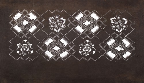 Katagami dyeing stencil with a motif of rhombuses forming crosses and plant-floral patterns