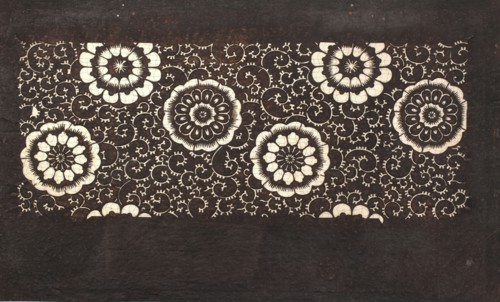 Katagami dyeing stencil with a motif of stylized flower rosettes and plant tendrils kawari kamon ni