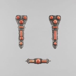 A set of braid ornaments consisting of a clasp and two pendants, late 18th century, Mongolian