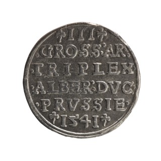 Obverse: Male bust in armour in profile turned right; short hair, long beard with sideburns. In the