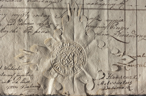 Round imprint of the seal of the town of Babimost, Poznan Voivodeship. On the crowned cartouche two